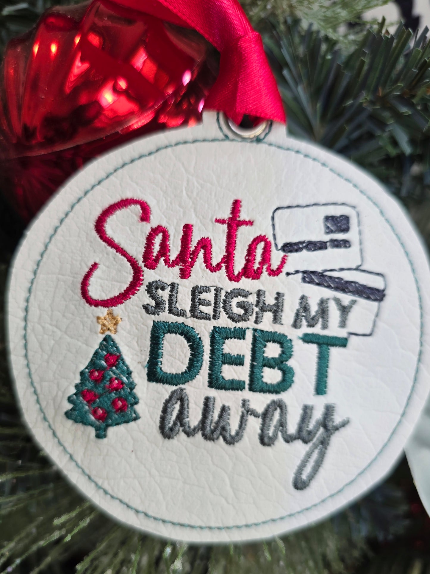 Santa sleigh my debt away, handcut vinyl ornament with satin ribbon