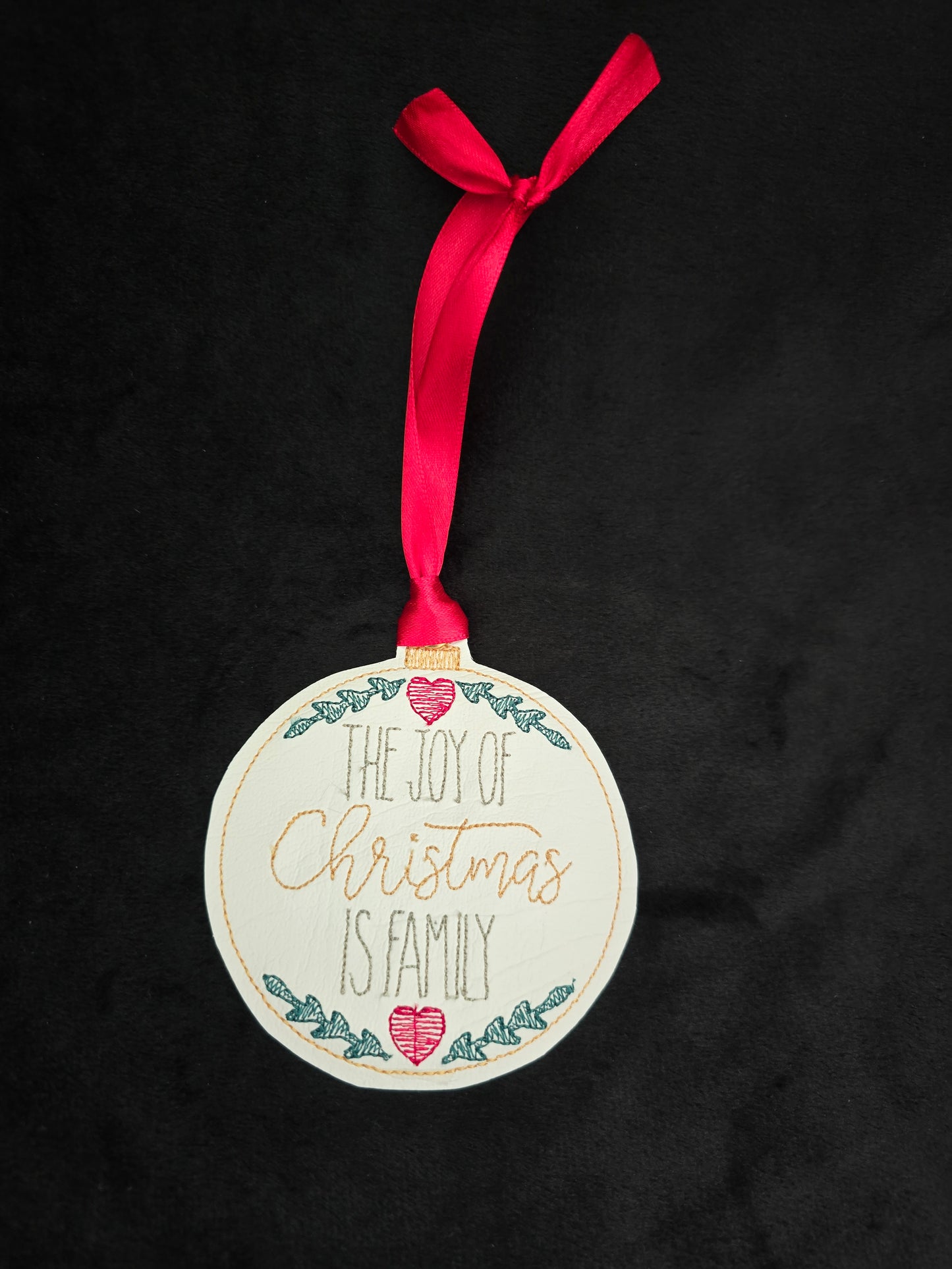 The Joy of Christmas is Family, handcut vinyl ornament with satin ribbon