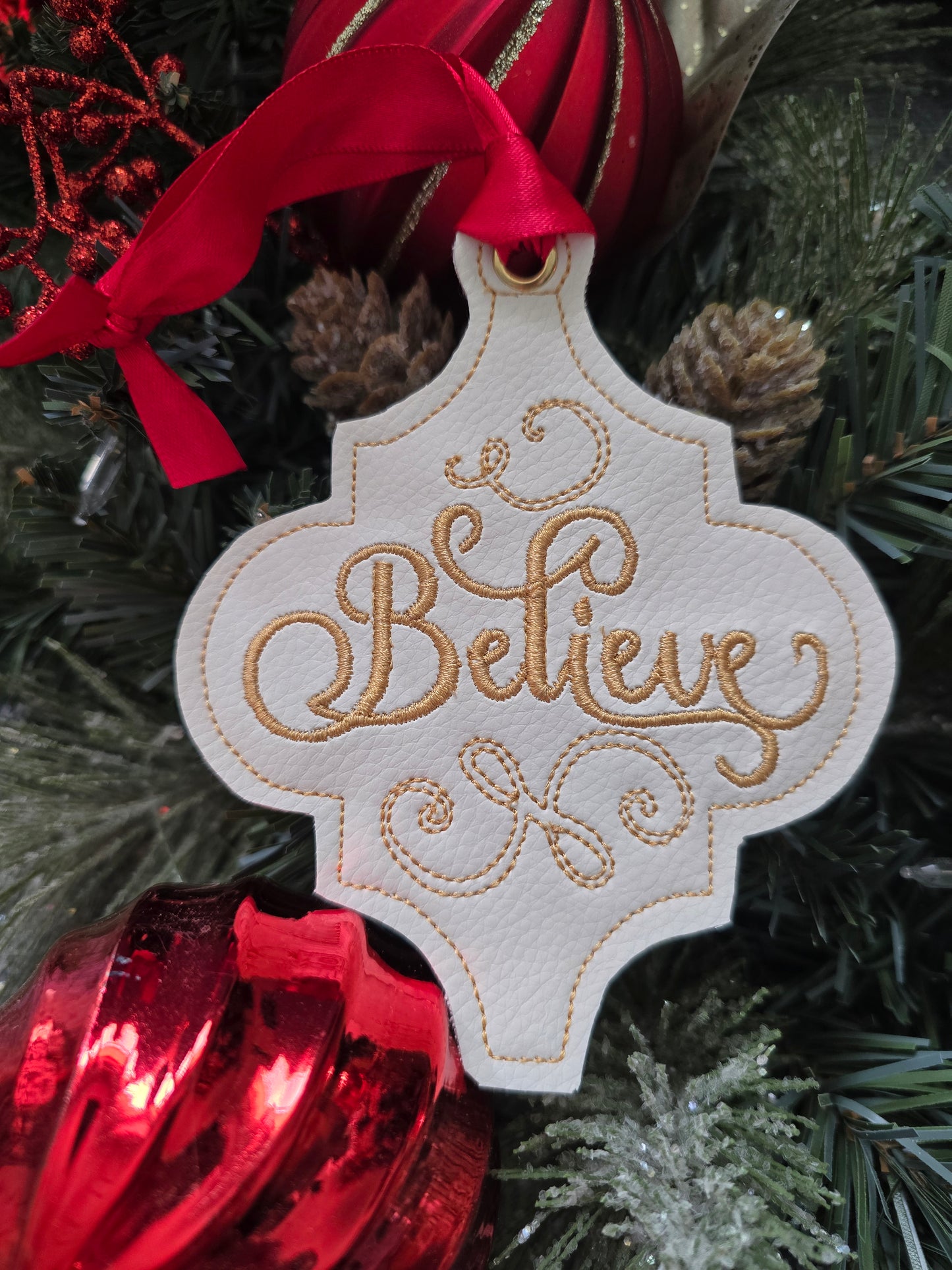 Believe, handcut vinyl ornament with satin ribbon