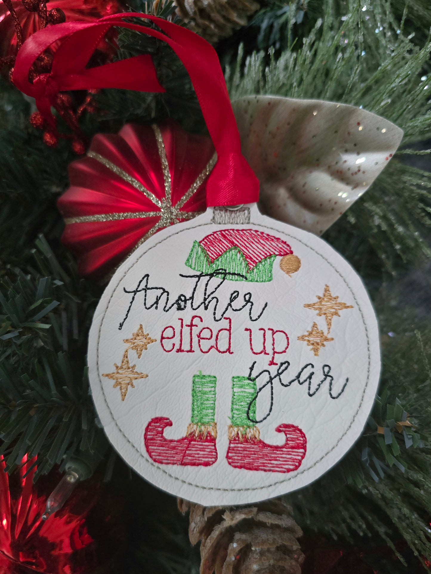 Another elfed up year, handcut vinyl ornament with satin ribbon