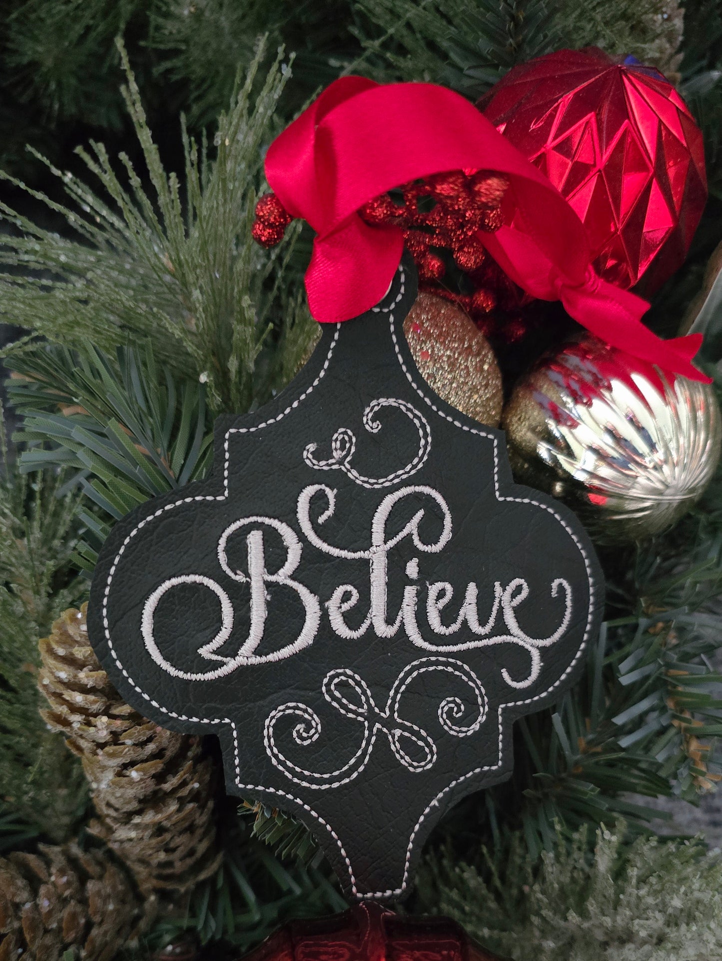 Believe, handcut vinyl ornament with satin ribbon